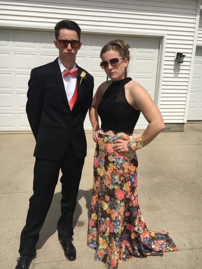Caleb and Janie dressed up for prom, looking cool in sunglasses.